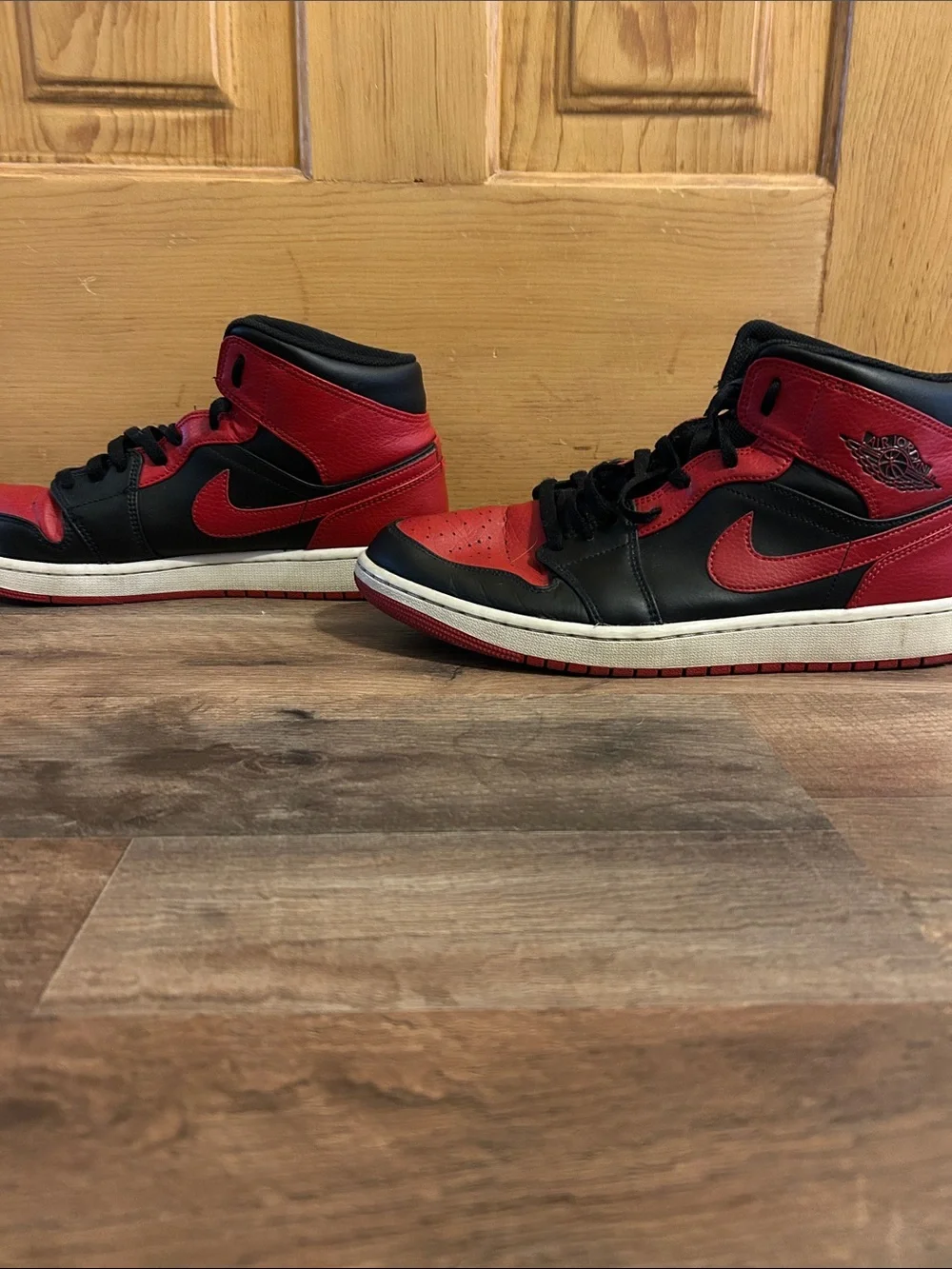 Jordan 1 Retro High Top Sneakers in Black and Red